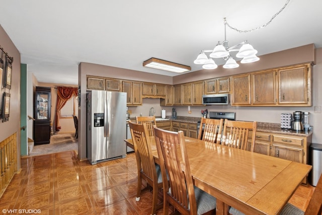 dining area featuring a chandelier