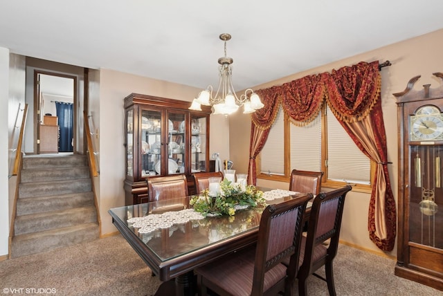 dining space with carpet floors, stairway, baseboards, and a chandelier