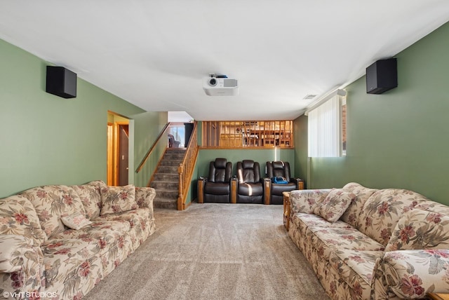 carpeted living area with stairs and visible vents