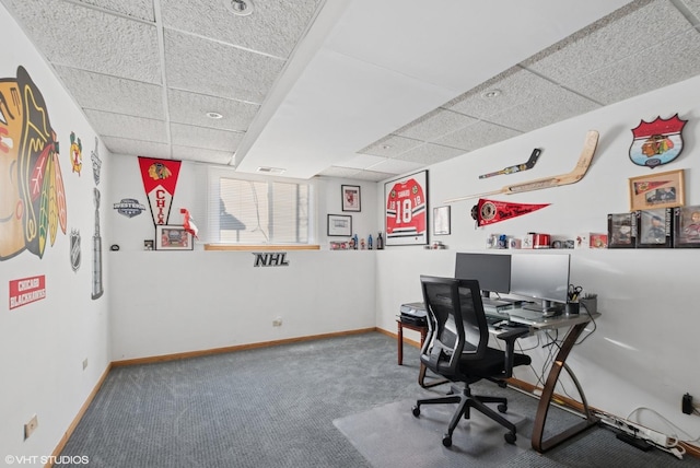 carpeted home office with a drop ceiling, visible vents, and baseboards