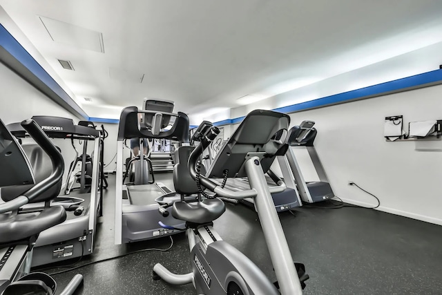 workout area with visible vents and baseboards