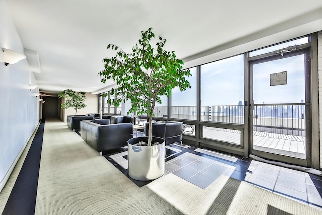 living area with tile patterned flooring and plenty of natural light