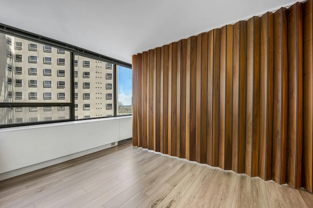 spare room with wood finished floors