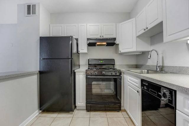 kitchen featuring visible vents, black appliances, a sink, white cabinets, and extractor fan