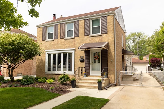 4128 N Plainfield Ave, Chicago, IL 60634 - view of front of property featuring a gate, a detached garage, brick siding, and a chimney
