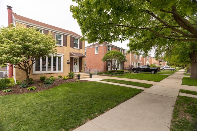 4128 N Plainfield Ave, Chicago, IL 60634 - view of front of property featuring a front lawn and brick siding