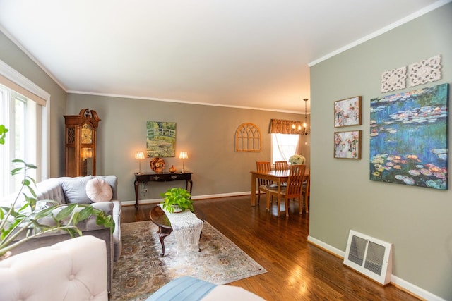 4128 N Plainfield Ave, Chicago, IL 60634 - living area with plenty of natural light, wood finished floors, ornamental molding, baseboards, and a chandelier