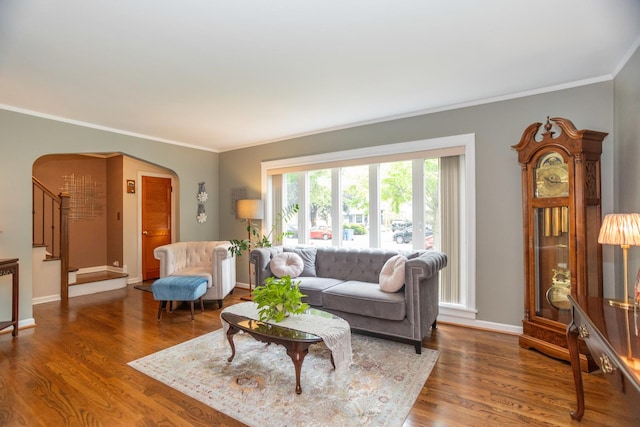 4128 N Plainfield Ave, Chicago, IL 60634 - living area featuring arched walkways, crown molding, stairs, wood finished floors, and baseboards
