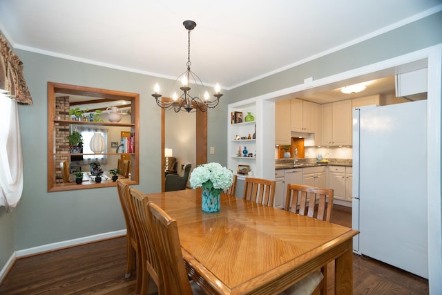 4128 N Plainfield Ave, Chicago, IL 60634 - dining room featuring a chandelier, dark wood-type flooring, ornamental molding, built in shelves, and baseboards