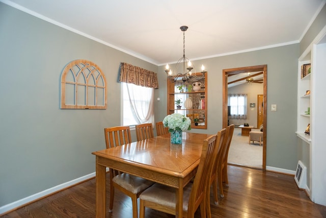 4128 N Plainfield Ave, Chicago, IL 60634 - dining room with a chandelier, ornamental molding, wood finished floors, a ceiling fan, and baseboards