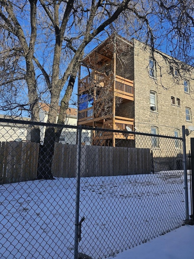 view of side of home with fence