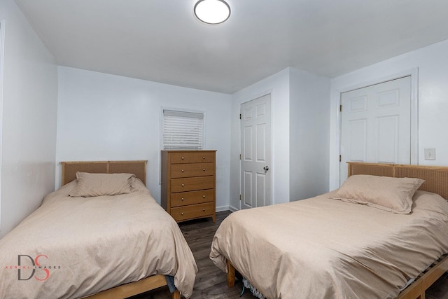 bedroom featuring dark wood finished floors