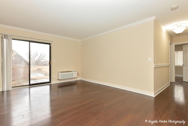 unfurnished room featuring ornamental molding, dark wood-style flooring, a wall mounted air conditioner, and baseboards