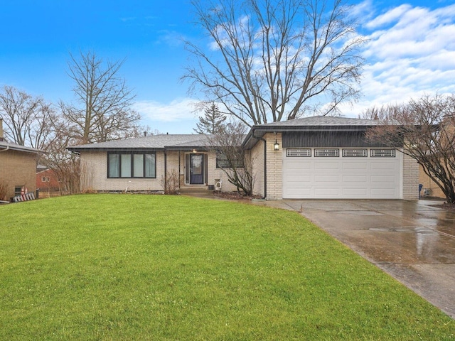 view of front facade with driveway, a front lawn, an attached garage, and brick siding