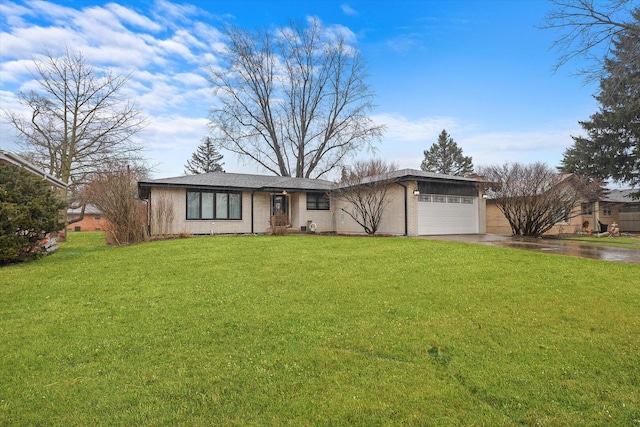 view of front facade featuring driveway, an attached garage, a front lawn, and brick siding