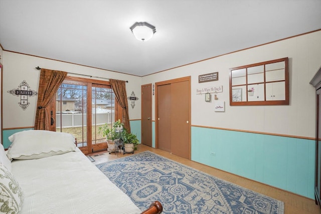 bedroom featuring access to outside and ornamental molding