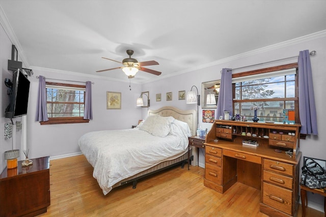 bedroom with baseboards, light wood-type flooring, a ceiling fan, and crown molding