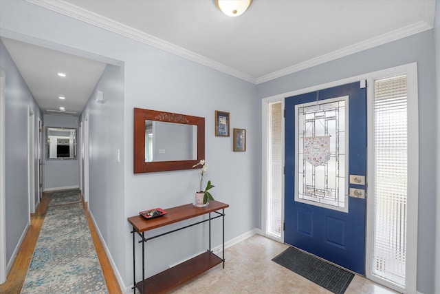 entryway with crown molding and baseboards