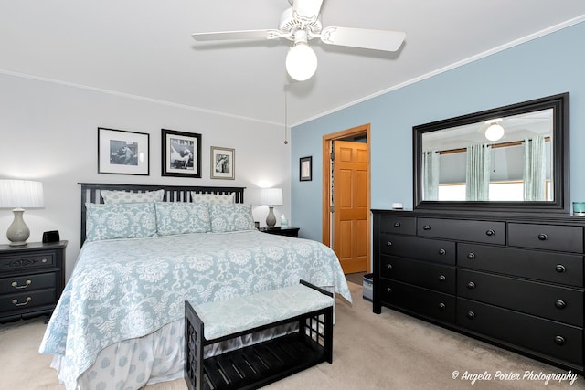 bedroom featuring ceiling fan, ornamental molding, and carpet