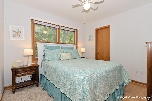 bedroom featuring light wood-style floors and baseboards