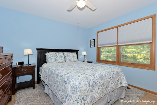 bedroom featuring ceiling fan and baseboards