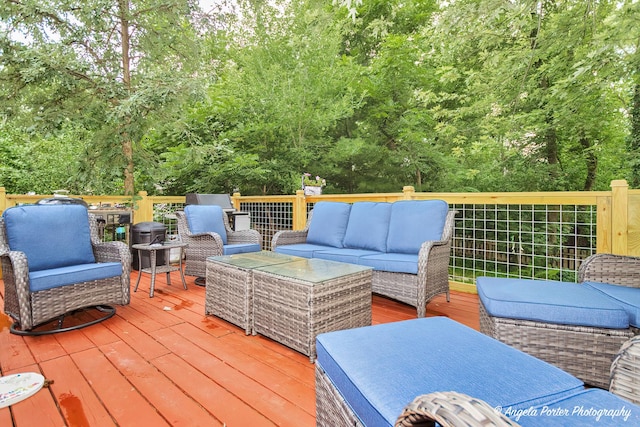 wooden terrace with outdoor lounge area