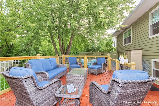 wooden deck featuring outdoor lounge area