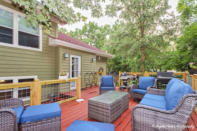 wooden terrace with an outdoor hangout area