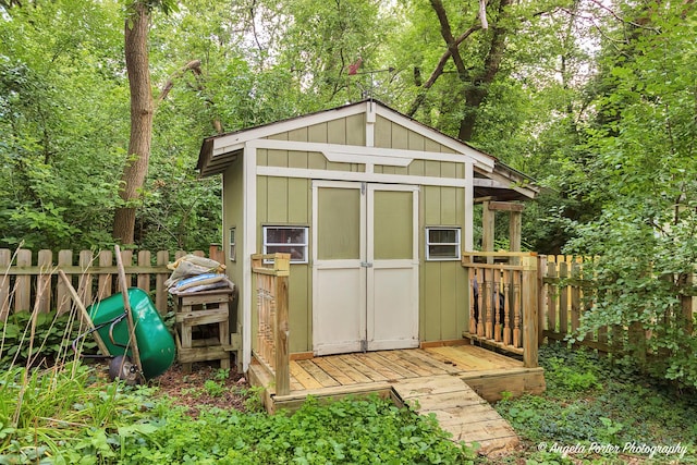 view of shed with fence