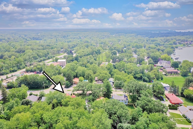 bird's eye view featuring a wooded view