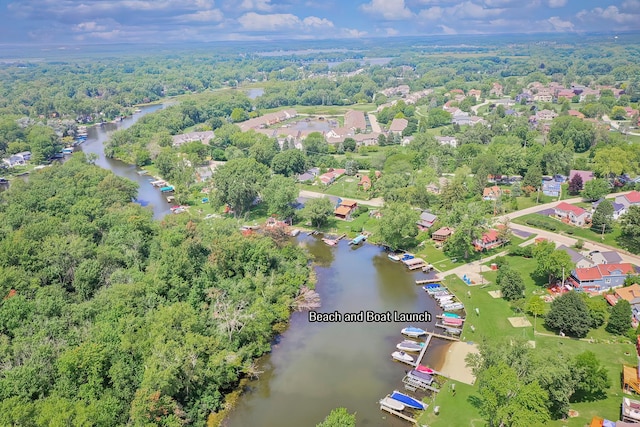 drone / aerial view featuring a water view and a residential view