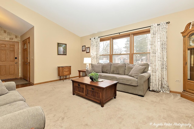 living area with light carpet, baseboards, and vaulted ceiling