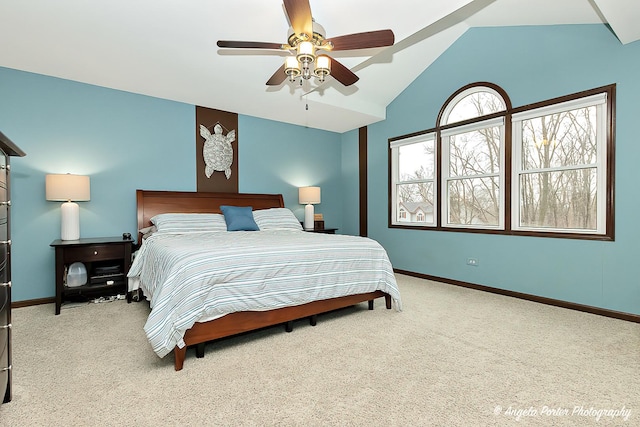 bedroom with carpet, ceiling fan, lofted ceiling, and baseboards