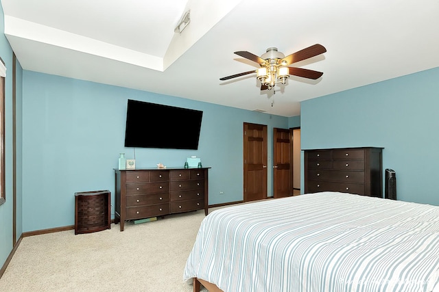 carpeted bedroom with ceiling fan, visible vents, and baseboards