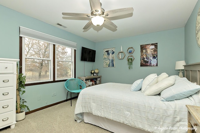 bedroom featuring visible vents, ceiling fan, light carpet, and baseboards