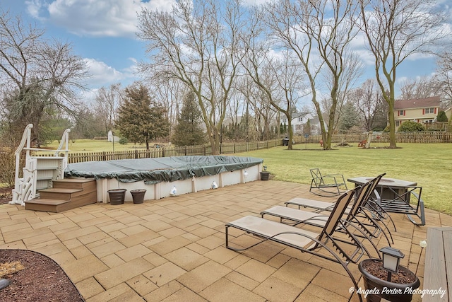 view of patio / terrace with a fenced backyard and a fenced in pool