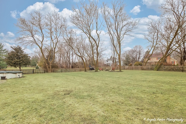 view of yard with a fenced backyard