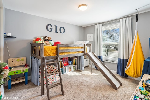 carpeted bedroom with baseboards