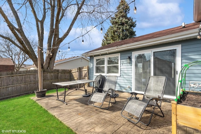 view of patio / terrace featuring fence