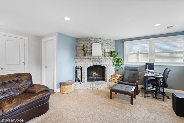 living area with visible vents, recessed lighting, carpet, baseboards, and a brick fireplace