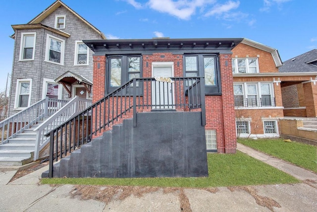 view of front of property featuring brick siding