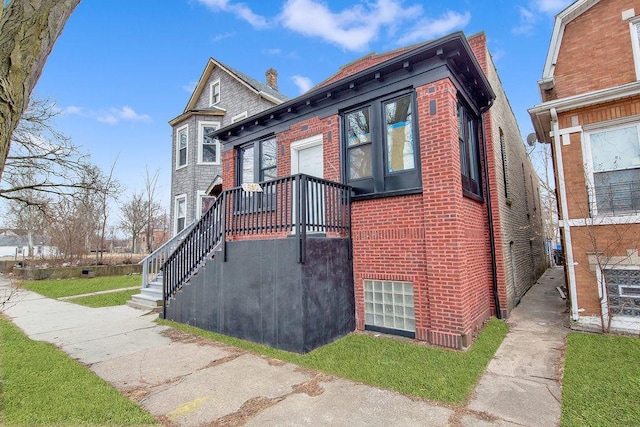 view of front of property featuring brick siding