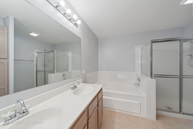 bathroom with a sink, a stall shower, and tile patterned floors