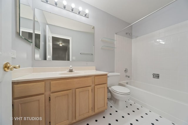 bathroom featuring tub / shower combination, toilet, and vanity