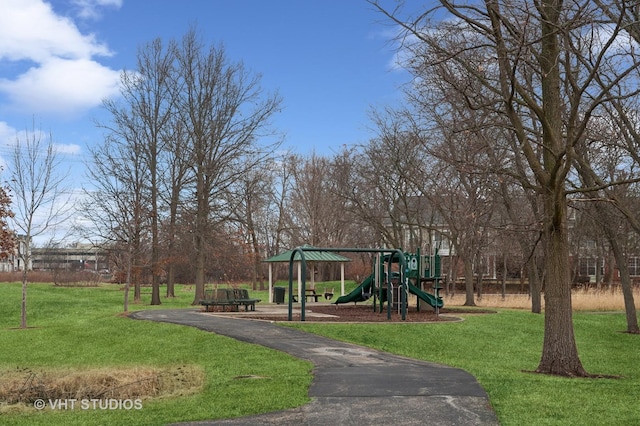 communal playground featuring a yard