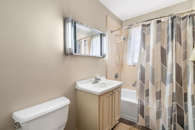 full bathroom with shower / bath combination with curtain, vanity, and toilet