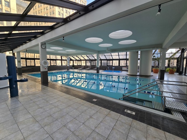 community pool with a patio area