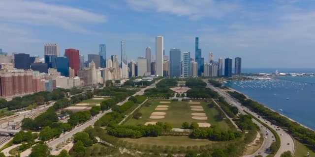 drone / aerial view with a water view and a city view