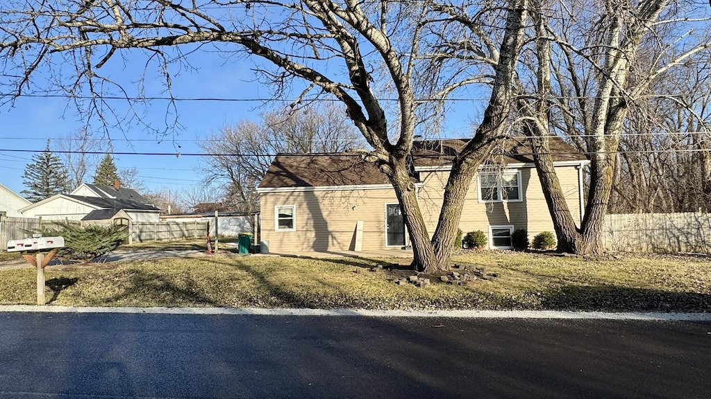 view of property exterior with fence