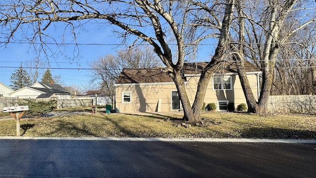 view of property exterior with fence